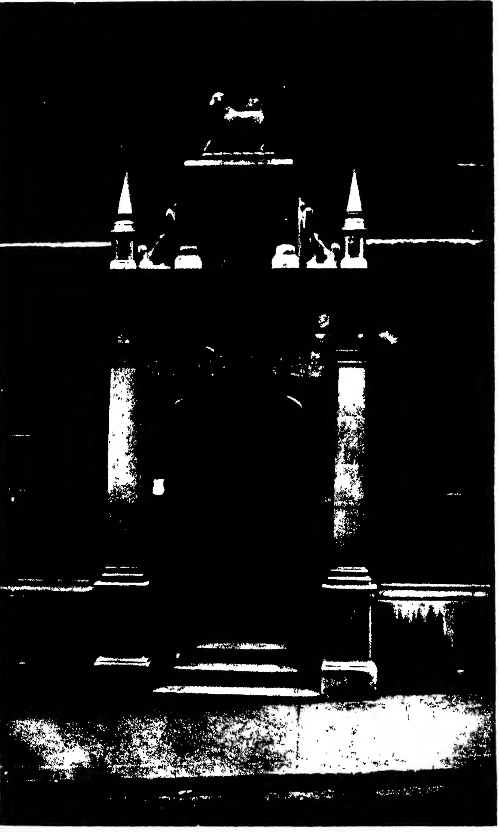 Photograph of the carving of “The Lamb and the Cross” as it appears over many doorways in “The Temple”